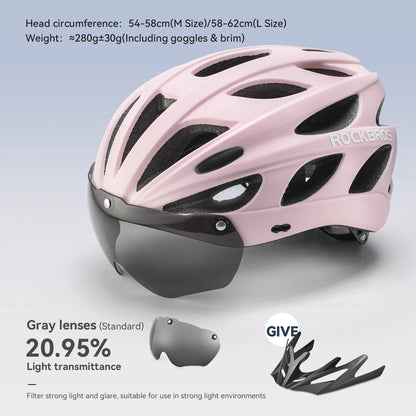 Pink helmet with black visor and goggles on a light gray background